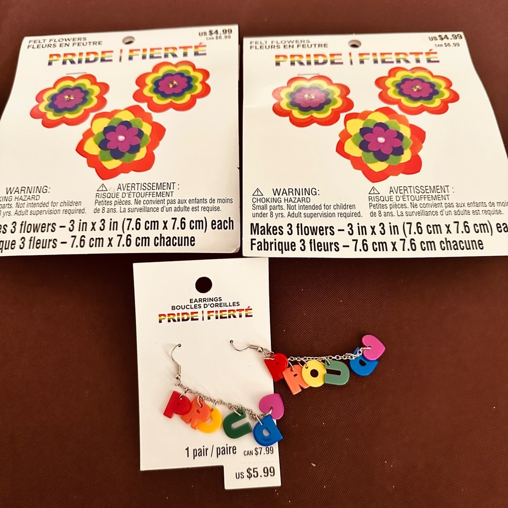 LGBTQIA - ready for pride month. Two pks of flowers and pair of earrings.